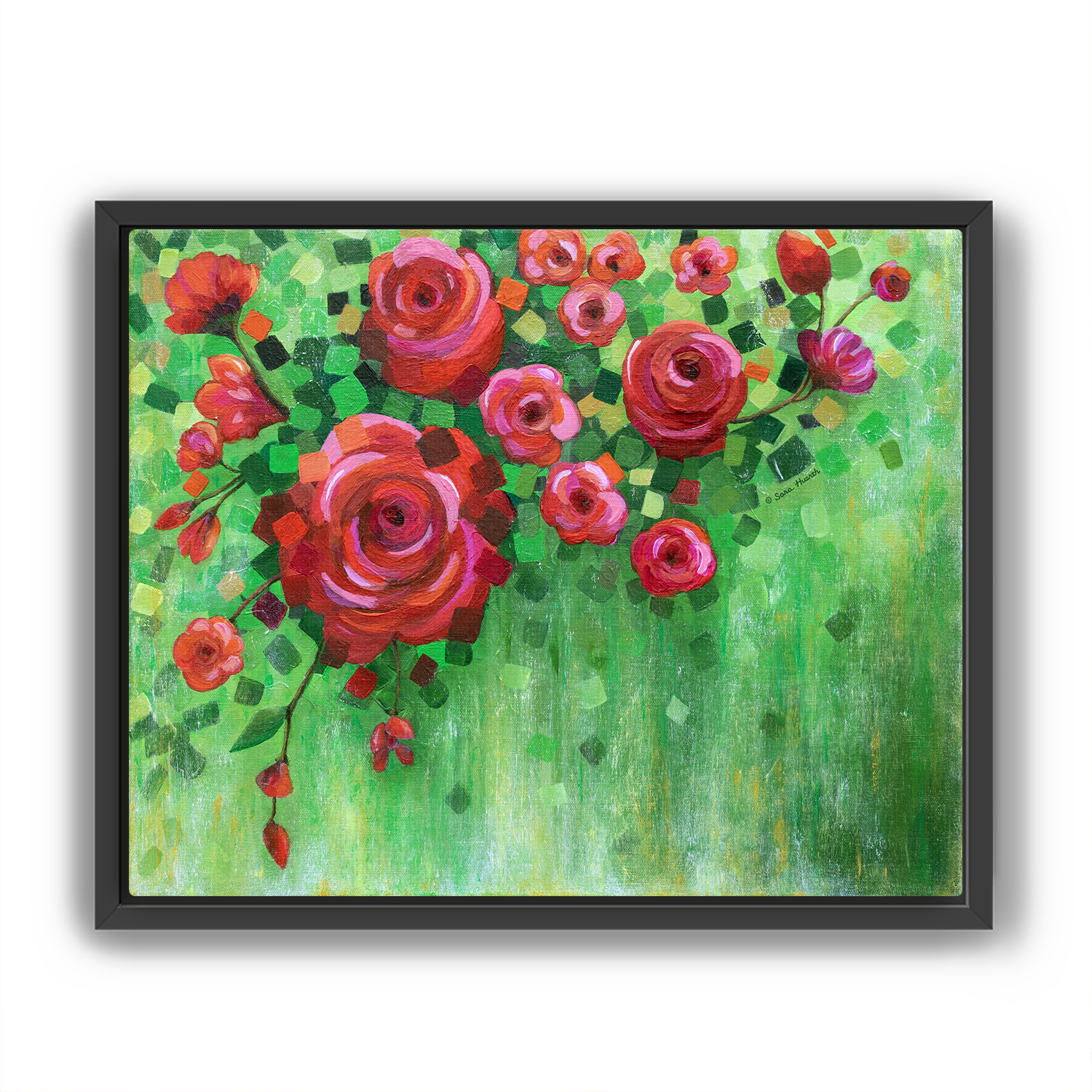Framed artwork of red and pink flowers on a green background