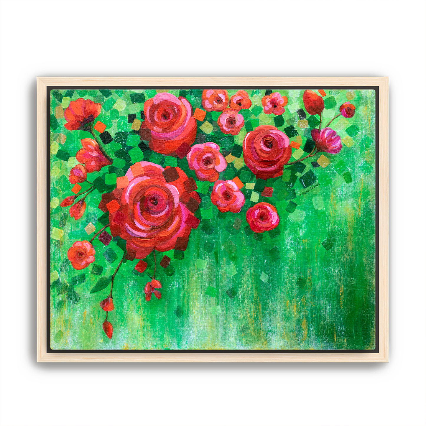 Framed artwork of red and pink flowers on a green background